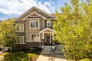 Two-story property featuring a multi-toned exterior with stone accents and siding - 4013 Blackbird Link, Edmonton, AB 