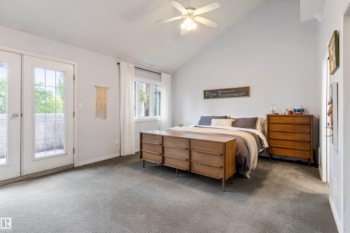 Vaulted ceiling bedroom featuring light gray carpeting and white walls - 10 Everest Crescent, St. Albert, AB 
