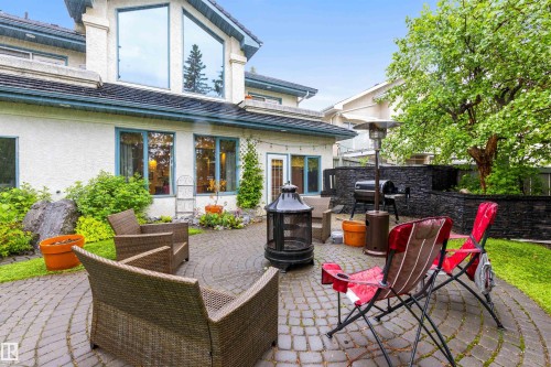Expansive outdoor patio featuring a circular paver design - 10 Everest Crescent, St. Albert, AB 