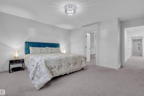 Spacious room featuring light gray walls and plush carpeting - 1616 157 Street, Edmonton, AB 