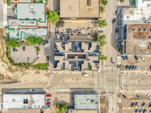 Mixed-use property featuring multiple buildings with diverse rooflines and varying architectural styles - 310 10606 102 Avenue, Edmonton, AB 