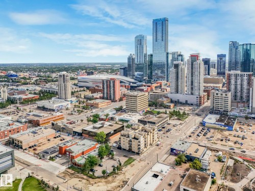 Expansive urban skyline featuring multiple high-rise buildings and surrounding city infrastructure - 310 10606 102 Avenue, Edmonton, AB 