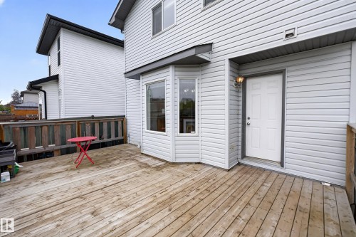 Spacious wood deck with a partial privacy fence - 8 Vega Avenue, Spruce Grove, AB - Outdoor With Exterior