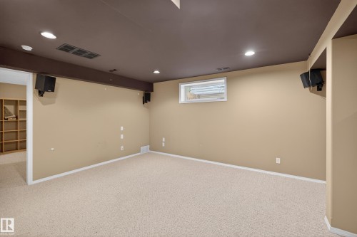 Carpeted room with recessed lighting and a window - 8 Vega Avenue, Spruce Grove, AB - Indoor Photo Showing Basement