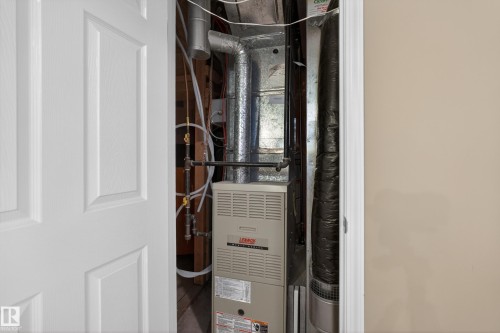 Utility closet featuring a furnace, ductwork, and exposed piping - 8 Vega Avenue, Spruce Grove, AB - Indoor Photo Showing Basement