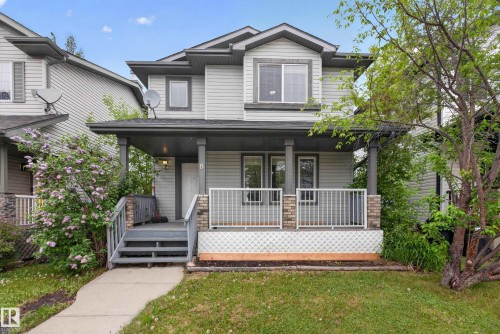 Two-story exterior with light gray siding and dark gray trim accents - 8 Vega Avenue, Spruce Grove, AB - Outdoor With Deck Patio Veranda With Facade