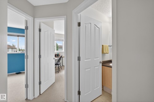 Hallway with light gray painted walls - 8 Vega Avenue, Spruce Grove, AB - Indoor Photo Showing Other Room