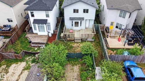 White siding two-story residence with a multi-level wooden deck - 8 Vega Avenue, Spruce Grove, AB - Outdoor
