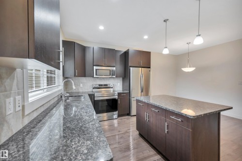 908 Valour Way, Edmonton, AB - Indoor Photo Showing Kitchen With Double Sink With Upgraded Kitchen