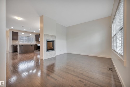 908 Valour Way, Edmonton, AB - Indoor Photo Showing Other Room With Fireplace
