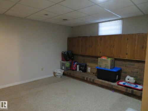 Room featuring wall-to-wall carpeting and white painted walls - 10720 57 Avenue, Edmonton, AB 