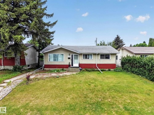 Ranch-style exterior with a stucco and horizontal panel facade - 5216 104A Street, Edmonton, AB - Outdoor