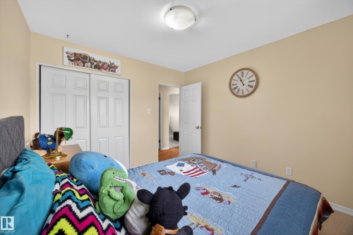 Bedroom featuring neutral-toned walls, white trim, and carpet flooring - 5216 104A Street, Edmonton, AB - Indoor Photo Showing Bedroom