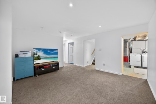 Carpeted room featuring white walls and recessed lighting - 5216 104A Street, Edmonton, AB - Indoor