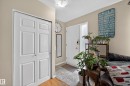 Entryway featuring a white paneled door, a white front door with sidelight, and neutral wall tones - 5216 104A Street, Edmonton, AB  - Indoor Photo Showing Other Room 
