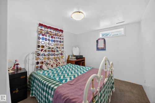 Bedroom featuring neutral-toned carpeting and white painted walls - 5216 104A Street, Edmonton, AB - Indoor Photo Showing Bedroom