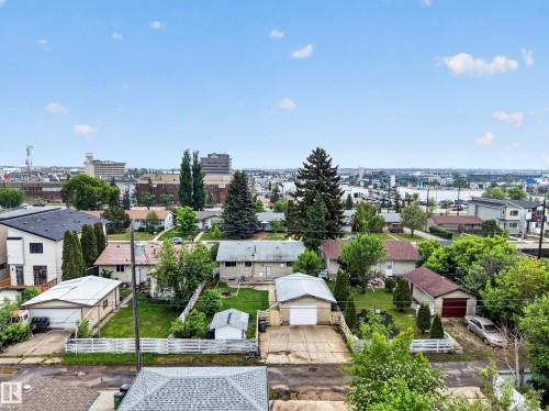 Aerial perspective showcasing a residential neighborhood with a mix of detached homes and mature landscaping - 5216 104A Street, Edmonton, AB - Outdoor With View