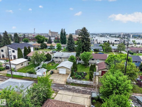 Aerial perspective highlighting the property with a detached garage and mature landscaping - 5216 104A Street, Edmonton, AB - Outdoor