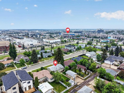 Aerial perspective showcasing a residential neighborhood with surrounding commercial districts - 5216 104A Street, Edmonton, AB - Outdoor With View