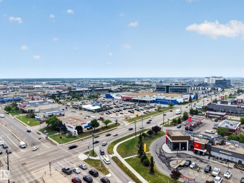 Expansive urban landscape featuring multiple commercial establishments, roadways, and vehicle activity - 5216 104A Street, Edmonton, AB - Outdoor With View