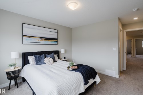 Neutral-toned bedroom featuring wall-to-wall carpeting and a flush-mount ceiling light - 9142 Pear Drive, Edmonton, AB - Indoor Photo Showing Bedroom