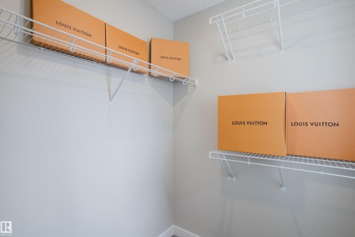 Spacious closet featuring white wire shelving - 9142 Pear Drive, Edmonton, AB - Indoor With Storage