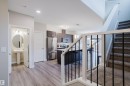 Open-concept living space featuring wood-finish flooring - 9142 Pear Drive, Edmonton, AB  - Indoor 