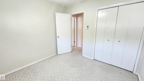Neutral-toned wall paint and textured carpeting - 8824 90 Street, Edmonton, AB 