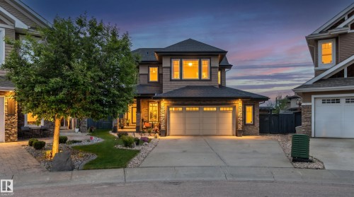Two-story residence featuring a stone and siding exterior with prominent gables - 5709 Mcluhan Bay, Edmonton, AB 