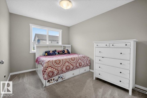 Neutral tone walls and carpeting create a versatile interior - 223 40A Avenue, Edmonton, AB - Indoor Photo Showing Bedroom