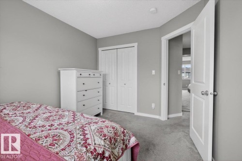 Plush grey carpeting and light grey wall finishes - 223 40A Avenue, Edmonton, AB - Indoor Photo Showing Bedroom