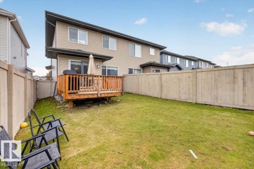Expansive green lawn with a full wooden privacy fence - 223 40A Avenue, Edmonton, AB - Outdoor