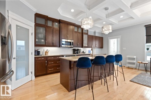 Kitchen With Bar-Style Counter Where It Could Have Three Stools. - 10216 89 Street, Edmonton, AB - Indoor Photo Showing Kitchen With Upgraded Kitchen