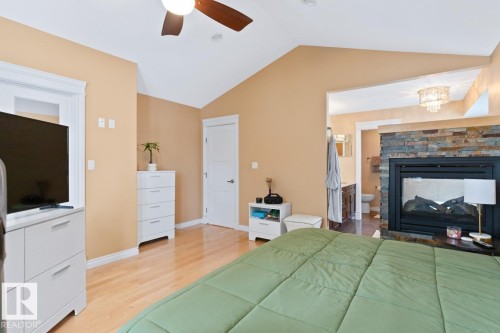 Primary Bedroom With 2-Sided Gas Fireplace, Walk-In Closet With Built-In Shelving. - 10216 89 Street, Edmonton, AB - Indoor With Fireplace