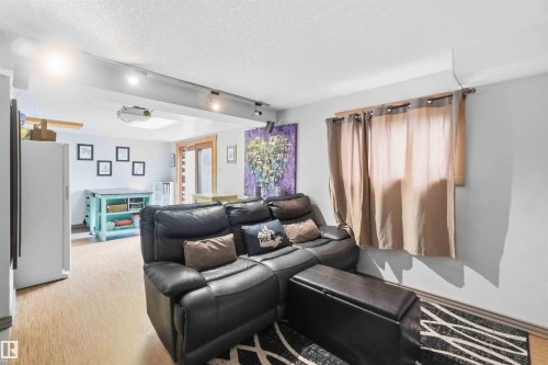 Open-concept living space featuring light wood-finish flooring, recessed lighting, and a track lighting system - #17 A 15031 Twp Road 462, Rural Wetaskiwin County, AB - Indoor