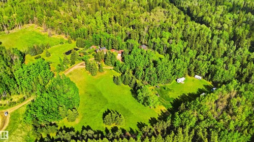 Expansive property featuring verdant forests, clearings, and multiple structures - #17 A 15031 Twp Road 462, Rural Wetaskiwin County, AB - Outdoor