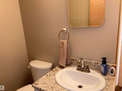Bathroom vanity with a granite-style countertop and an integrated sink - 