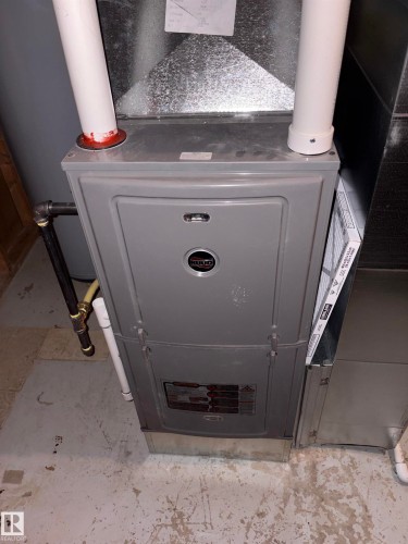 Gray-toned HVAC unit with visible ductwork and PVC piping - 167 Ridgewood, St. Albert, AB - Indoor