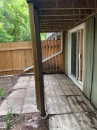 Ground-level patio area featuring concrete pavers - 