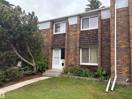 Brick facade townhouse with a shingle-clad second-story exterior - 167 Ridgewood, St. Albert, AB - Outdoor