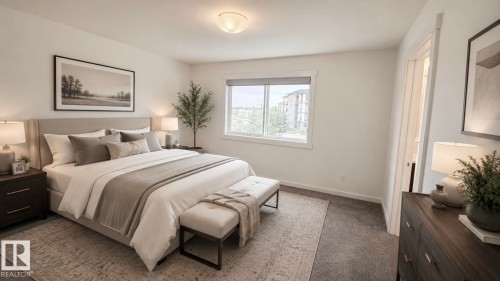 Spacious bedroom featuring neutral wall tones, window with white trim, recessed ceiling light, and carpet flooring - 3962 Claxton Loop, Edmonton, AB - Indoor Photo Showing Bedroom