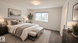 Spacious bedroom featuring neutral wall tones, window with white trim, recessed ceiling light, and carpet flooring - 