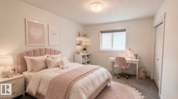 Bedroom featuring light-colored walls and carpeted flooring - 
