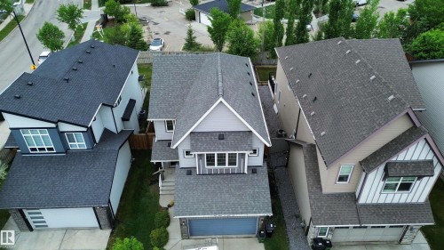Modern residential architecture featuring a light grey exterior with dark grey trim - 3962 Claxton Loop, Edmonton, AB - Outdoor