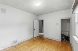 Hardwood-finish flooring with white baseboards - 