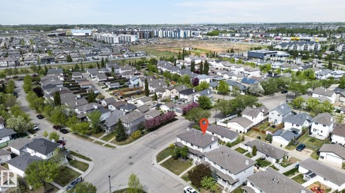 Aerial perspective showcasing a residential neighborhood with a mix of detached and attached properties - 21244 90 Avenue, Edmonton, AB 