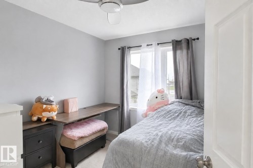 Compact room featuring light gray walls and a single window with a dark curtain rod - 41 5102 30 Avenue, Beaumont, AB 