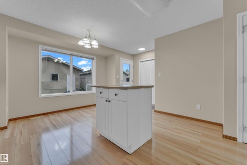 Bright interior space featuring light wood-finish flooring - 3134 30 Avenue Nw, Edmonton, AB 