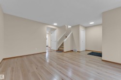 Light wood-finish flooring extending throughout the main level - 