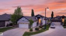 Contemporary home featuring a gabled roofline, stone veneer accents, and a dual-car garage - 624 Cantor Landing Landing, Edmonton, AB 